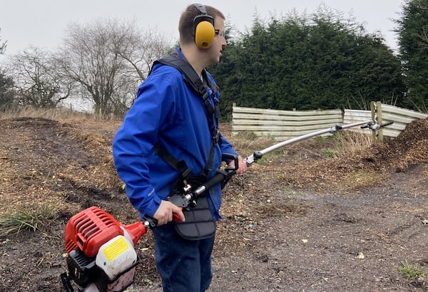 Using the BUK0 long reach hedge trimmer to trim tall hedges around the garden centre