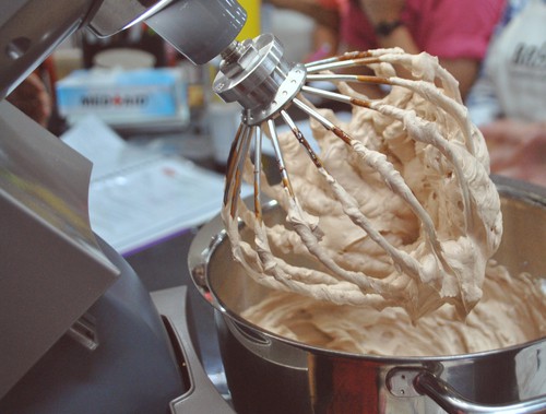 Stand mixer being tested to see how the attachment handles cake mixes