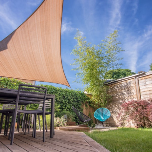 Installing and testing shade sail in my garden to provide shade over the patio area