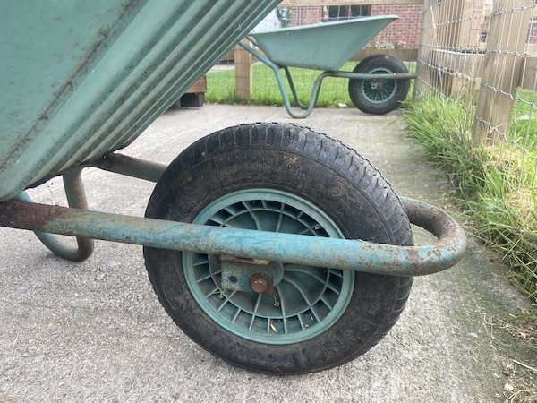 Wheelbarrow wheel design and frame