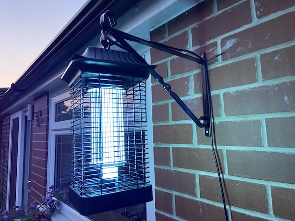 UV Electric fly killer hung outside right next to my seating area