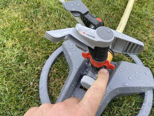 Turn the orange clips to adjust the rotating spray from 25 degrees for a part circle to 360 for a full circle