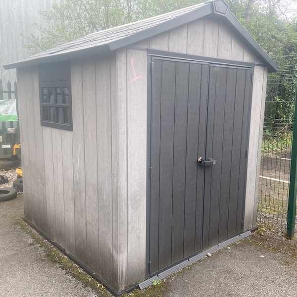A large plastic garden shed my wife uses to store childrens toys at the childrens nursery