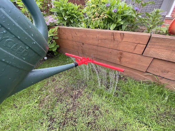 Lawn bar sprinkler used to apply Richard Jackson Flower Power Premium Lawn Magic Feed onto my lawn