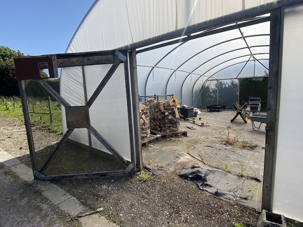 Polytunnel doors that open outwards and made form wood and netting to allow air flow