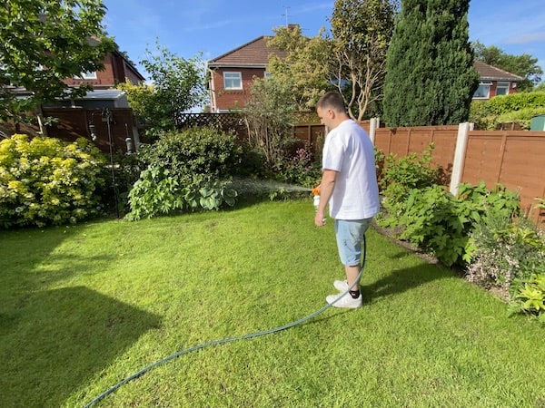 Using envii Greenkeeper’s Secret Spray on Lawn Feed to green up the lawn