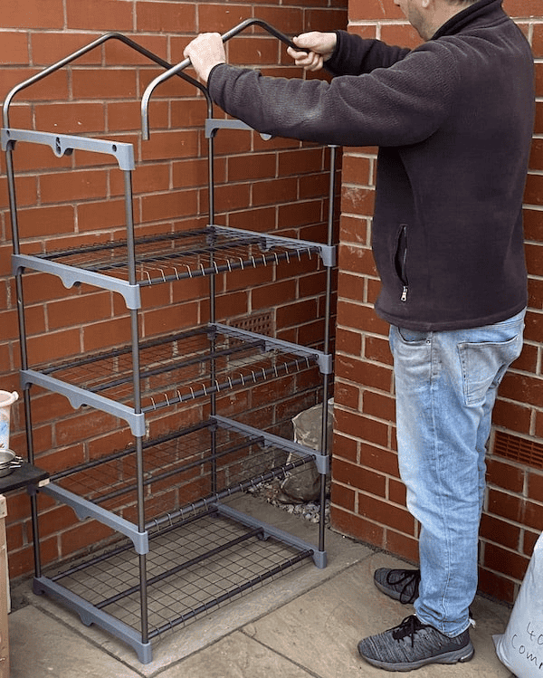 The frame on the Woodside 4 Tier Garden Greenhouse just slots together
