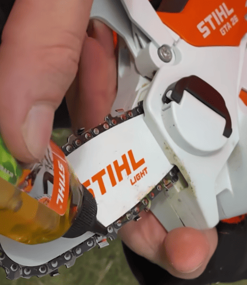 Oiling the chain on my Stihl GTA 26 Mini Pruner, which I do before I use it