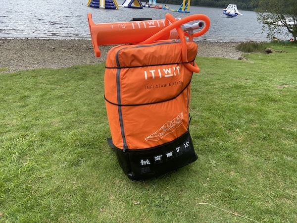 The TIWIT 100 2/3 Inflatable Kayak. comes with a nice bag although the carry straps could be better. I've got a smaller foldable trolley for fiver from B&M to move it around and its great
