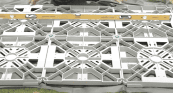 Hawklok Plastic Shed Base Kit being installed, no gravel needed with this design and good locking system