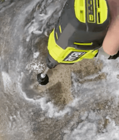 Ryobi 18V ONE+ Cordless 22bar Power Washer cleaning concrete patio